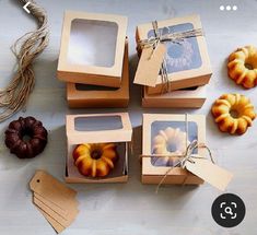 several boxes with different types of pastries in them