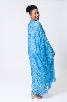 Elevate your summer style with the elegant touch of silver featured in this lightweight kimono. Its versatility makes it ideal for beach days, lunches, or date nights, ensuring you'll make a statement wherever you go this season. Blue Cover-up For Summer Party, Blue Summer Party Cover-up, Blue Wrap Kimono For Beachwear, Blue Wrap Kimono For Summer, Blue Wrap Kaftan For Festivals, Summer Light Blue Kaftan, Spring Blue Wrap Kaftan, Elegant Summer Vacation Kimono, Blue Open Front Kaftan For Vacation