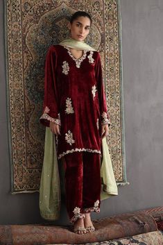 Elevate your winter wardrobe with this elegant Maroon loose fitting A line velvet kurti, perfect for formal occasions, weddings, and fashion enthusiasts KURTI(Top): This beautiful maroon velvet kurti features intricate multi colour resham thread embroidery with beads and sequin  BOTTOM: Complementing the kurti is a straight velvet pant it has embroidery over the bottom of the pant for a complete and elegant look. ☑ DUPATTA: The dress will have green single gold lace  borders organza dupatta ( in Luxury Velvet Anarkali Set, Luxury Unstitched Velvet Salwar Kameez, Luxury Velvet Anarkali Set With Sheer Dupatta, Elegant Luxury Velvet Anarkali Set, Velvet Wedding Dress Pakistani, Velvet Pakistani Dress, Velvet Kurti, Velvet Suit Design, Kurti Top