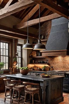 a kitchen with an island and lots of lights hanging from it's ceiling beams