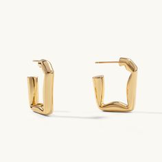 The much-loved classic hoops get an edgy upgrade with these folded rectangular hoop earrings, an ode to simplistic style statements using deconstructed geometry. Slim posts give this subversive-basic design effortless wearability, perfect for your newest Ear Party look.

Size: 24.5x22mm
Material: 18k Gold Plated On Brass Modern Hoop Earrings With Rectangular Links For Everyday, Rectangular Minimalist Hoop Earrings, Tarnish Resistant, Minimalist Rectangular Hoop Earrings, Tarnish Resistant, Minimalist Rectangular Tarnish-resistant Hoop Earrings, Modern Rectangular Tarnish Resistant Huggie Earrings, Modern Tarnish-resistant Rectangular Huggie Earrings, Yellow Gold Square Hoop Earrings For Everyday, Modern Rectangular Tarnish-resistant Hoop Earrings, Modern Square Hoop Earrings For Everyday