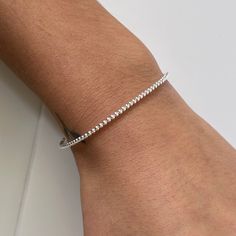 The perfect minimalist ball bracelet - you'll put it on and never want to take it off. Wear it on its own or layer with other pieces from our collection. 💖 Details Balls: approx 2 mm Width: 2 mm Length: 17.5 💕 Online store: www.thejewellerytree.net 💕 Stay up-to-date with new designs & special offers  - Join our online community - FOLLOW ME   Socials: @myjewellerytree OR  https://www.facebook.com/thejewellerytree1/  💕 Need more info, feel free to email or DM - I'd love to help 💕And please visit my store https://www.etsy.com/au/shop/TheJewelleryTreeCo to see lots more quality sterling silver and gemstone jewellery We care about the environment so when you buy any of our pieces, you'll receive beautiful long lasting jewellery with minimal packaging - a card made of recycled paper and a s Minimalist Stackable Adjustable Tennis Bracelet, Minimalist Adjustable Stackable Tennis Bracelet, Adjustable Ball Chain Bracelet For Everyday, Minimalist Ball Chain Bracelets As Gift, Dainty Ball Chain Bracelet For Everyday, Minimalist Sterling Silver Tennis Bracelet For Everyday, Everyday Ball Chain Bracelet, Dainty Everyday Ball Chain Bracelet, Everyday Beaded Ball Chain Bracelet