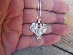 "Heart shape Angel wings necklace,.. 1 1/2\" tall with bail by 1 5/8\" wide at the widest spot, cast in sterling silver 925....the chain is 18\" long also in sterling silver 925..last photo is the back..." Sterling Silver Heart Jewelry With Angel Wings, Anniversary Sterling Silver Wing-shaped Necklaces, Silver Wing-shaped Necklace For Valentine's Day, Silver Angel Wings Necklace, Elegant Heart-shaped Angel Wings Necklace, Angel Wing Necklace, Cuff Bracelets Handmade, Turquoise Bracelet Cuff, Wing Necklace