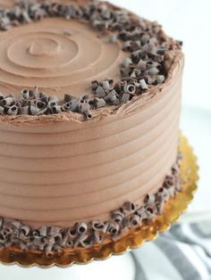 a cake with chocolate frosting and sprinkles on it