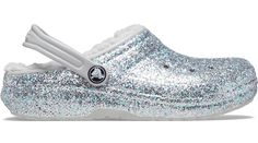 This toasty lined version of the Classic Clog in an adorable glittery material will keep your little ones feeling cozy and stylish all season long. The soft, fuzzy liner adds to the cushion and comfort, indoors or out, and Croslite™ foam construction keeps them light and easy to wear. Sparkle on!  Toddler Classic Lined Glitter Clog Details:    • The legendary Classic Clog with a warm, fuzzy liner  • Incredibly light and fun to wear  • Pivoting heel straps for a more secure fit  • Great indoors o Crocs Classic Clogs, Ventilation System, Clogs Shoes, Free Kids, Shine Bright, Strap Heels, Big Kids, Special Features, Kids Shoes