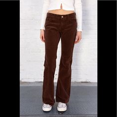 Low Rise Flare Leg Tight Fit Pants With 5 Pockets, Belt Loops, And A Button And Zipper Closure. Fabrics: 98% Cotton, 2% Elastane Measurement: 9.5" (24 Cm) Rise, 33" (84 Cm) Inseam, 30" (76 Cm) Waist Made In: China Brandy Melville Pants, Brown Trousers, Brown Pants, John Galt, Fit Pants, Corduroy Pants, Pants Outfit, Workout Pants, Brandy Melville