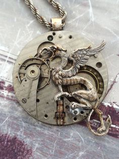 Griffin Steampunk Necklace  #Steampunk #newfromold #ilm #vintagejewelry #industrialdesign #steampunkart #neovictorian #handmade #steampunkjewelry #timlesstreasure Steampunk Diy Crafts, Steampunk Gadgets, Steampunk Pocket Watch, Steampunk Couture, Steam Punk Jewelry, Industrial Jewelry, Steampunk Diy, Pocket Watch Antique, Fairy Necklace