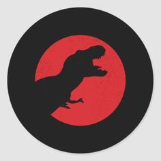 a black and red sticker with an image of a t - rex on it