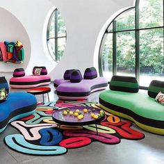 a living room filled with lots of colorful furniture