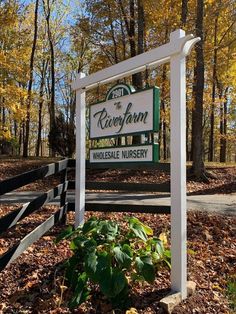 the welcome sign to rosefawn nursing home nursery in fall colors with leaves on the ground