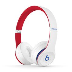 the beats by dr dre headphones are white with red and blue trims