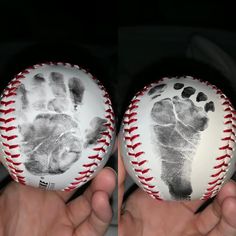 two hands holding baseballs with hand prints on them