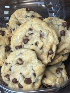 a plastic container filled with chocolate chip cookies