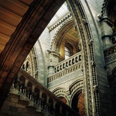 the inside of a building with stairs and arches