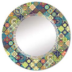 a round mirror with colorful designs on it