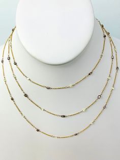 Fine brown and yellow diamond station necklace. Necklace 25pcs 2x3.3mm -2.7x5mm brown diamond beads and 24pcs 2x3.5-2.2x4.3mm light yellow diamonds hand wrapped in stations around a 46" long 18k yellow gold chain. Metal - 18K Yellow Gold Diamonds - 10cts (estimated) Length - 46" Extra Long Necklace, Yellow Diamonds, Necklace Necklace, Station Necklace, Brown Diamond, Yellow Gold Chain, Yellow Diamond, Light Yellow, Earring Necklace