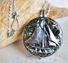 Sailboat Music Box Locket in Silver #musicbox #photolocket #onlineboutique #giftsforanyoccasion Music Box Locket, Cheap Diamond Rings, Sailboat Design, Black Gold Jewelry, Turquoise Jewelry Native American, Real Gold Jewelry, Necklace Collection, Photo Locket, Silver Lockets