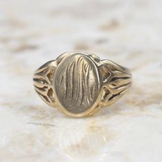 Antique 14k gold signet ring hand-engraved with the initials W.M. On the face. Cut-out designs on the shoulders of the band. Era: Victorian c.1900 Markings: S (maker's mark) Materials: 14k gold Ring Size: 9 1/4 (comes with one free resizing by our jeweler) Face measures 13mm x 10.33mm Weight: 4.3 grams Condition: Good antique condition with minor surface wear from age  Shipping is free in the United States Follow us on Instagram @LUXXORVintage 14k Gold Signet Ring, Hudson Ny, Gold Signet Ring, Cut Out Design, 14k Gold Ring, Hand Engraving, Signet Ring, Rings Statement, Makers Mark