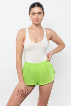 The Cotton Fishnet Shorts are cut in a classic Dolphin short silhouette, with high leg openings on the sides and an elasticized waistband. Our cotton mesh fabric is knit locally to be breathable and lightweight, making it a universal summer staple. For a monochromatic look, we recommend wearing the RIN401GD Cotton Fishnet Mock Neck T-Shirt in a matching color. This item can also be layered with any of our swimsuits, intimates, performance wear, or bodysuits. Great for lounging, sleeping, water a Beachwear Mesh Bottoms For Beach, Casual Mesh Beach Bottoms, Summer Athletic Shorts With Elastic Side Panels, White Mesh Bottoms For Summer, Casual Mesh Bottoms For Beach, Nylon Bottoms With Built-in Shorts For Beach Season, Stretch Nylon Shorts For Summer, Stretch Mesh Seamless Bottoms, Seamless Stretch Mesh Bottoms