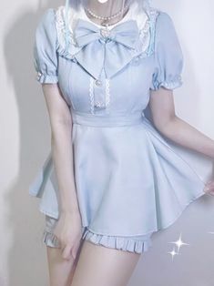 This is a set consisting of a dress and shorts. The dress features a lace-trimmed collar and ruffle cuffs, as well as a decorative bow and sewn lace trim at the chest. The shorts also have pleated edges. Elevate your wardrobe with this charming dress and shorts set. The dress boasts delicate lace trim along the collar and pleated cuffs, adding a touch of elegance to the ensemble. Adorned with a sweet bow and sewn lace trim at the chest, the dress exudes a lovely, feminine appeal. The accompanyin Plus Size Goth Fashion, Ruffle Trim Shorts, Plus Size Kawaii, Tie Strap Dress, Pan Collar Dress, Puff Sleeves Dress, Shorts Dress, Gothic Skirts, Jirai Kei