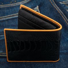 Genuine Black Ostrich Leg Skin Leather Men's Wallet    Crafted from genuine ostrich leg skin leather;    Interior is genuine ostrich skin leather;  Provides 12 credit card slots, two bill compartments, and a clear ID window;  Size – 11cm x 9.5cm (4 3/8” x 3 3/4”);  Hand-made wallet.   Looking for a simple wallet that packs a powerful punch? Then look no further than Genuine Black Ostrich Leg Skin Leather Wallet. Its elegant lines and luxurious feel will let you organize your money efficiently an Black Leather Wallets With Crocodile Pattern, Black Leather Wallet With Crocodile Pattern, Ostrich Legs, Diy Leather Projects, Wallet Craft, Simple Wallet, Window Size, Basement Makeover, Home Stairs Design