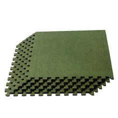 several pieces of green foam with black squares