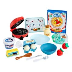 an assortment of toys including eggs, pans and utensils