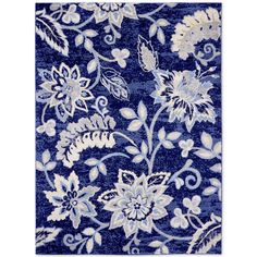 a blue rug with white flowers on it