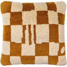 a brown and white checkered pillow on a white background