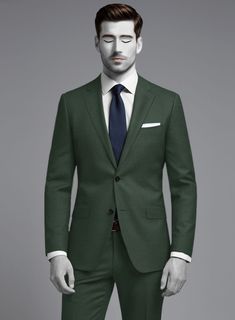 Freshen up your sartorial wardrobe with our Napolean Green Wool Suit, both strong in style and high in quality this suit promises unmatched comfort all day long. Crafted from wool blend, the napolean suit is stylishly designed from the super fine wool fabric. Pair this with matching waistcoat, a crisp white shirt, a dark gray tie and black dress shoes to seal your ensemble.   Look Includes  Napolean Green Wool Fabric  Two Button Jacket Style  Notch Lapel  Horn Royal Black Buttons  Single Vent  T Green Wool Suits For Winter, Fitted Green Wool Suit, Luxury Green Wool Suits, Green Notch Lapel Suit With Button Closure, Green Tailored Suit With Button Closure, Brown Corduroy Jacket, Grey Wool Suit, Blue Linen Shirt, Green Velvet Jacket