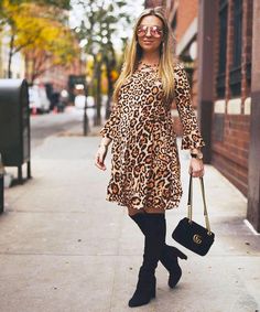 Trend alert: all things Leopard! Our fun-loving "Lennie" shift dress is flattering for stylish expecting mamas with super chic pockets and flare sleeves. Style with over-the-knee boots for fall. Only 2 left (XS, S)! Roomy shift style with loose fit, crisscross neckline Adorable pockets, 3/4 flared sleeves Above-the-knee length 96% Polyester and 4% Spandex Wear during and after pregnancy Click for Size Chart. Model wears size S. X-Small (0-2): Bust 28-33" Small (4-6): Bust 33-36" Medium (8-10): B Fall Bell Sleeve Dresses For Workwear, Chic Maternity Dress For Fall, Maternity Stores, Boots For Fall, Flare Sleeves, Sleeves Style, After Pregnancy, Fun Loving, Celebrity Look