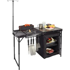 an outdoor cooking station with utensils and other kitchen items on it's shelf