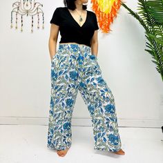 "Cotton Palazzo Pants, Summer Flowy Pants, Women Bohemian Trousers with Pockets, Spring Loose Hippie Lightweight Pants, Floral Prints Hit the summer in style with these lightweight floral Palazzo pants. Featuring bohemian-inspired prints and cotton fabric, the trousers provide all-day comfort with chic and boho flair. The flowy cuts and pockets allow for complete freedom of movement, so you can stay cool and stylish. Handmade Material: Organic Cotton  Size: Free Size and Plus Size Adjustable Waist Two Side Pockets Free Size: Length- Approx. 38\"                   Waist- Approx. 26\" to 40\"                    Hips- Approx. 44\"                   Inseam- Approx. 28\" Plus Size:  Length- Approx. 38\"                   Waist- Approx. 32\" to 48\"                   Hips- Approx. 48\" Bohemian Floral Print Bottoms For Vacation, Casual Boho Print Pants For Vacation, Hippie Boho Print Vacation Bottoms, Casual Boho Print Harem Pants For Vacation, Summer Harem Pants With Pockets, Bohemian Floral Print Beach Bottoms, Bohemian Floral Beach Bottoms, Bohemian Bottoms With Pockets For Vacation, Bohemian Summer Bottoms With Floral Print