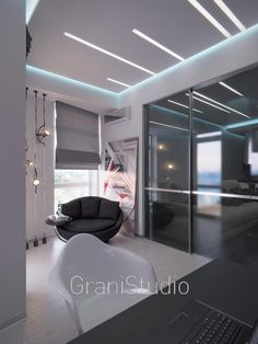 a laptop computer sitting on top of a desk in front of a glass sliding door