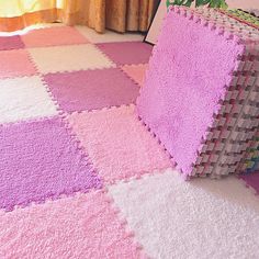 a pink and white rug on the floor