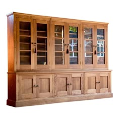 a wooden china cabinet with glass doors and drawers