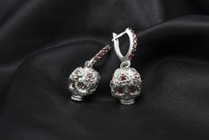 "Silver skull earrings \" Flover Frida\" Metal - Sterling Silver 925 Gemstones - cubic zirconia Weight - 10 grams. We need 2 weeks to make a earrings with various changes such as: -other size (Custom order only) -other jewelry stones -and so on Please check all my ring's catalog to choose your favorite https://www.etsy.com/shop/YetiBikersJewelry All of our items have been designed and produced by ourselves All your feedback is very important for us. Please don't forget to leave us a positive fee Fine Jewelry In Pierced Metal, Sterling Silver Skull Jewelry Hallmarked, Pierced Metal Jewelry For Anniversary, Skull Shaped Metal Earrings For Gifts, Gothic Metal Jewelry For Anniversary, Metal Hallmarked Drop Earrings, Silver Skull Earrings For Pierced Ears, Gothic Silver 925 Stamped Jewelry, Gothic Silver Jewelry Stamped 925