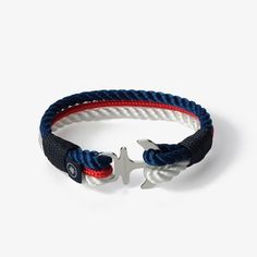 Dive into the depths of style with the Oceanic Fusion Nautical Rope Bracelet. This striking accessory captures the essence of the sea and adds a touch of sophistication to your look. It features two twisted nautical ropes, one in a vibrant blue and the other in a pristine white, seamlessly intertwined with a sleek, slender braided rope in a deep, alluring red. Crafted with precision, the Oceanic Fusion Nautical Rope Bracelet is made to order, ensuring a perfect fit for any wrist size. The stainless steel clasp adds a hint of elegance, symbolizing your resilience and determination as you navigate the currents of life.  Embrace the harmonious fusion of style and strength with the Oceanic Fusion Nautical Rope Bracelet. Whether you're exploring the shores or making a statement in the city, thi Nautical Rope, Sea Lover, Anchor Bracelet, Unisex Gift, Braided Rope, Presents For Friends, Unisex Gifts, Vibrant Blue, Braided Bracelets