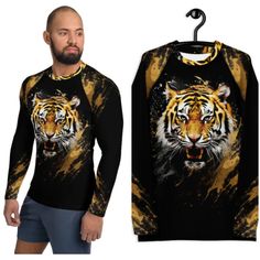 Don't let sunburn, wind, sand, or other elements ruin your day! This Men's Smooth & Versatile Rash Guard Activewear Shirt with a Unique Tiger Design will protect you while you have fun doing sports. It is slim-fitted with flat ergonomic seams, and a bit longer than your casual tee for extra comfort and protection. * 82% polyester, 18% spandex * Very soft four-way stretch fabric that stretches and recovers on the cross and lengthwise grains * UPF 50+ * Comfortable longer body and sleeves * Flat s Long Sleeve Sports Shirt For Summer, Long Sleeve Shirt For Summer Sports, Casual Crew Neck Rash Guard For Water Sports, Yellow Sports Shirt For Summer, Yellow Summer Sports Shirt, Moisture-wicking Crew Neck Top For Water Sports, Casual Long Sleeve Tops For Water Sports, Graphic Print Crew Neck Top For Water Sports, Crew Neck Top With Graphic Print For Water Sports