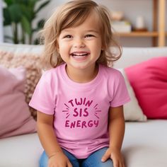 **This listing is for one shirt.** As a twin toddler mom, myself - our days are non-stop with lots of outdoor time and zoomies. If your twins are the same, I hope they'll enjoy wearing these matching shirts while they cruise through your neighborhood or your living room.  Feel free to look at the matching 'twin bro energy' shirt using the link, below.  Twin Bro Energy T-shirt listing: https://twinlifecreative.etsy.com/listing/1790082039 Please reach out with any questions. Thank you! ----------- Pink Short Sleeve T-shirt For Daycare, Pink Short Sleeve Tops For Daycare, Cute Pink T-shirt For Daycare, Playful Personalized Cotton Tops, Casual Tops With Funny Text For Playtime, Personalized Cotton Tops For Playtime, Personalized Cute Tops For Playtime, Twins Gift, Twin Shirts