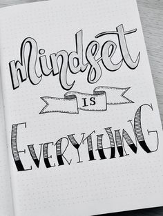 a notebook with the words mindset is everything written in cursive writing on it