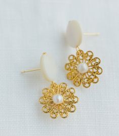 * Use discount FOURITEMS to get 10% off when you purchase 4 items or more across all our products (jewelry, ceremony items, etc) * Designed and handcrafted in the Philippines * Gold-plated brass stud and flower, along with backings that consists of secure lock backs * Made with mother of pearl and South Sea pearls, locally sourced from Minglanilla & Cebu City to support traditional crafts * 1.5inches in length and 0.5inch in width, lightweight to wear all day * Materials are locally and ethicall Filipino Crafts, Filipino Jewelry, Seaside Gardens, Working Hands, Pearl Rosary, Sun Shining, Cebu City, Mini Earrings, Mother Of Pearl Earrings