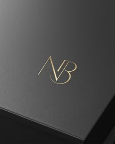 a black and gold business card with the letter b on it's front cover