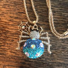 Chain Is 25-26” With 2” Extender. Gold Tone Metal. Web Charm Dangles In Front Or Back Of Spider. Blue Costume Jewelry With Chain, Blue Necklace With Lobster Clasp For Party, Blue Chain Costume Jewelry, Spider Choker Necklace, Gold Spider Necklace, Wire Spider Necklace, Spider Brooch Jewelry, Spider Necklace, Betsey Johnson Jewelry