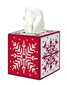 a red and white tissue box with snowflakes on it