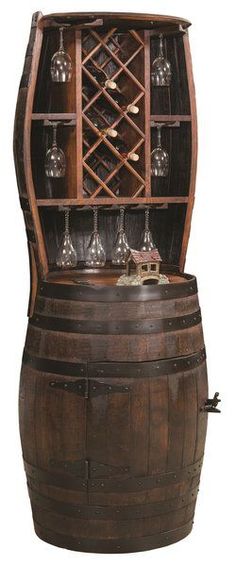 an old wooden barrel with wine glasses on the top and bottom shelf filled with wine