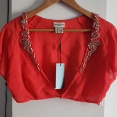 Stunning Bright Coral Karen Millen Bolero Shrug With Intricate Silver Beaded Detailing And Flutter Short Sleeves. Never Worn With Tags And Extra Beads. Fits Us Size 10. Semi-stitched Luxury Bollywood Blouse, Luxury Silk Thread Blouse Piece With Intricate Embroidery, Luxury Silk Blouse Piece With Cutdana, Luxury Silk Blouse Piece With Gota Work, Luxury Silk Blouse Piece With Intricate Embroidery, Luxury Silk Thread Blouse Piece With Cutdana, Luxury Silk Thread Blouse Piece With Dori Work, Luxury Silk Thread Blouse Piece For Diwali, Affordable Silk Blouse Piece With Cutdana