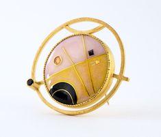 This modern convertible brooch pendant has a 24K gold cloisonne vitreous enamel on silver jewel in a geometric design with deep black, petal pink and warm yellow set into gold vermeil over sterling silver with faceted black spinel, enamel measures 1" diameter, overall 1.5" *please use my contact page to request additional details Unique Yellow Gold Enamel Brooch, Luxury Gold Enamel Pin Gift, Luxury Gold Enamel Pin As Gift, Luxury Gold Enamel Pin For Gift, Modernist Gold Brooches For Gifts, Contemporary Formal Brooch Jewelry, Modernist Gold Brooch Jewelry, Modern Gold Collectible Jewelry, Modernist Gold Brooch