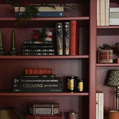 the shelves are filled with books and other decorative items