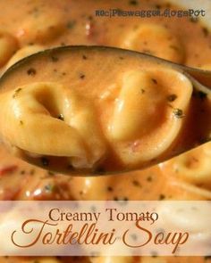 a spoon full of creamy tomato soup with dumplings in it and the title overlay reads, creamy tomato soup